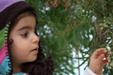 Curious little girl with hat clipart