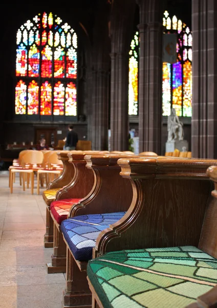 Empty colorful benches of church — Stock Photo, Image