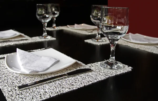 stock image Glass, fork and knife on the restaurant table