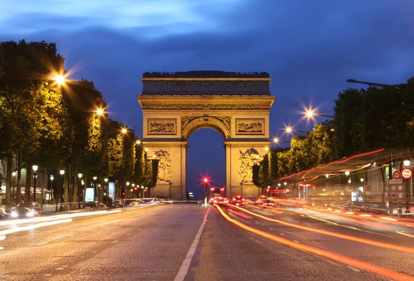 Arc De Triomphe and light trails — Stock Photo, Image