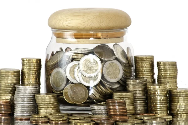 A jar full of coins on white background — Stock Photo, Image