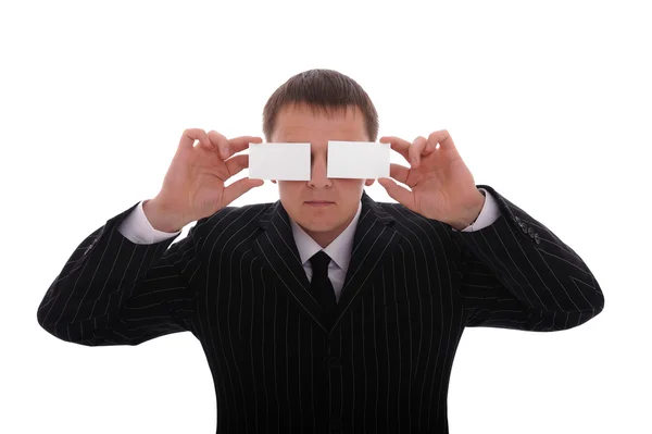 Affärsman som täcker hans ögon med visitkort — Stockfoto
