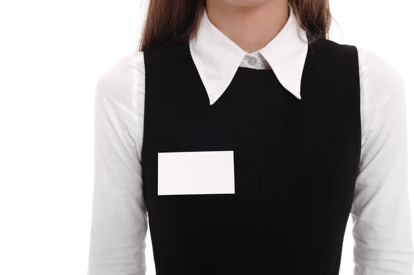 stock image A woman wears a blank name tag.