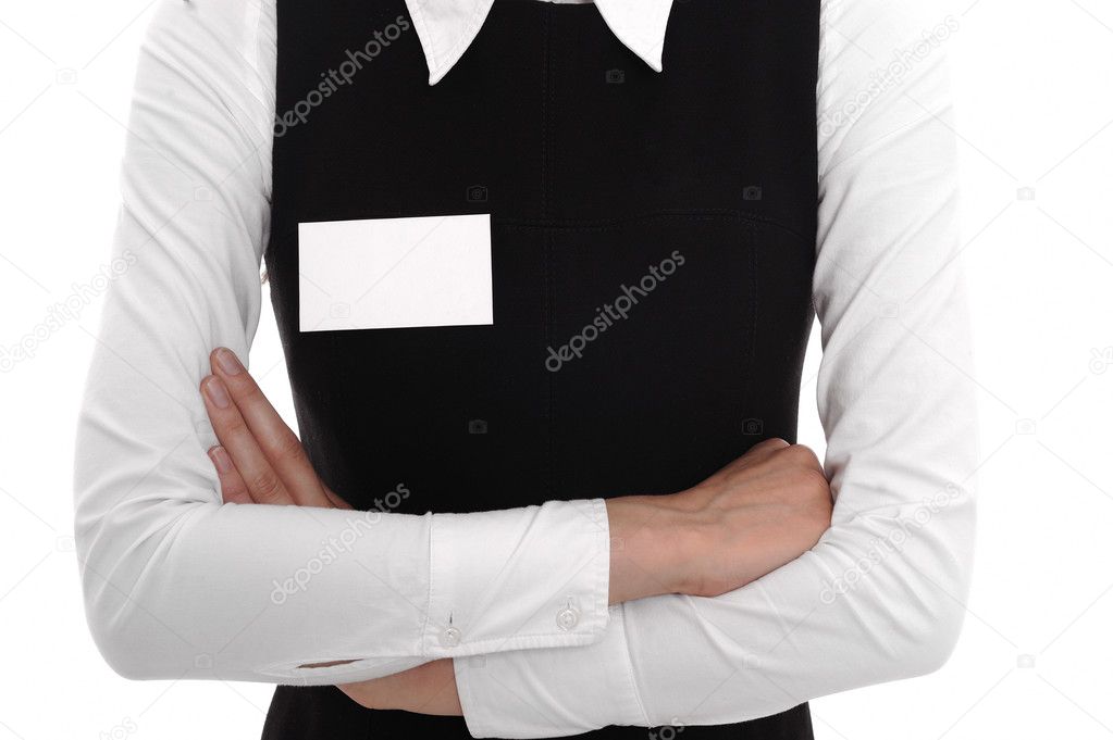 A woman wears a blank name tag.