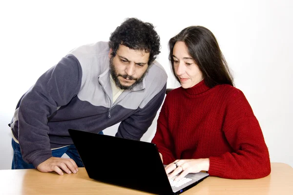 Middle-aged couple with laptop — Stock Photo, Image