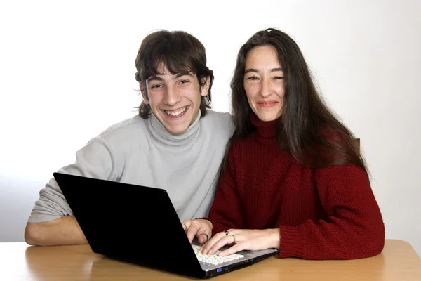 Woman and son looking at laptop — Stock Photo, Image