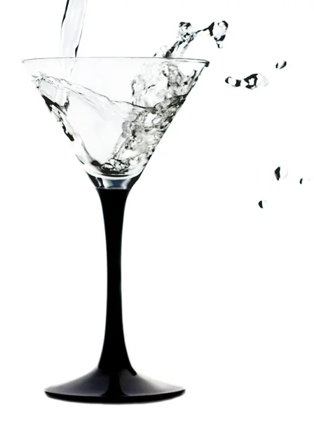 Splash v koktejlové skleničce Stock Snímky