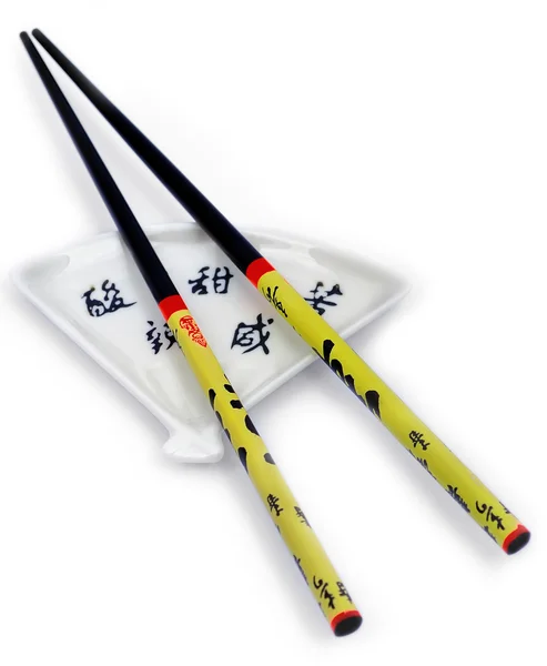 Chopsticks on a saucer — Stock Photo, Image