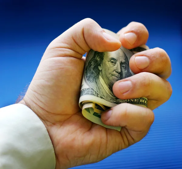 Os dólares estão em uma mão — Fotografia de Stock