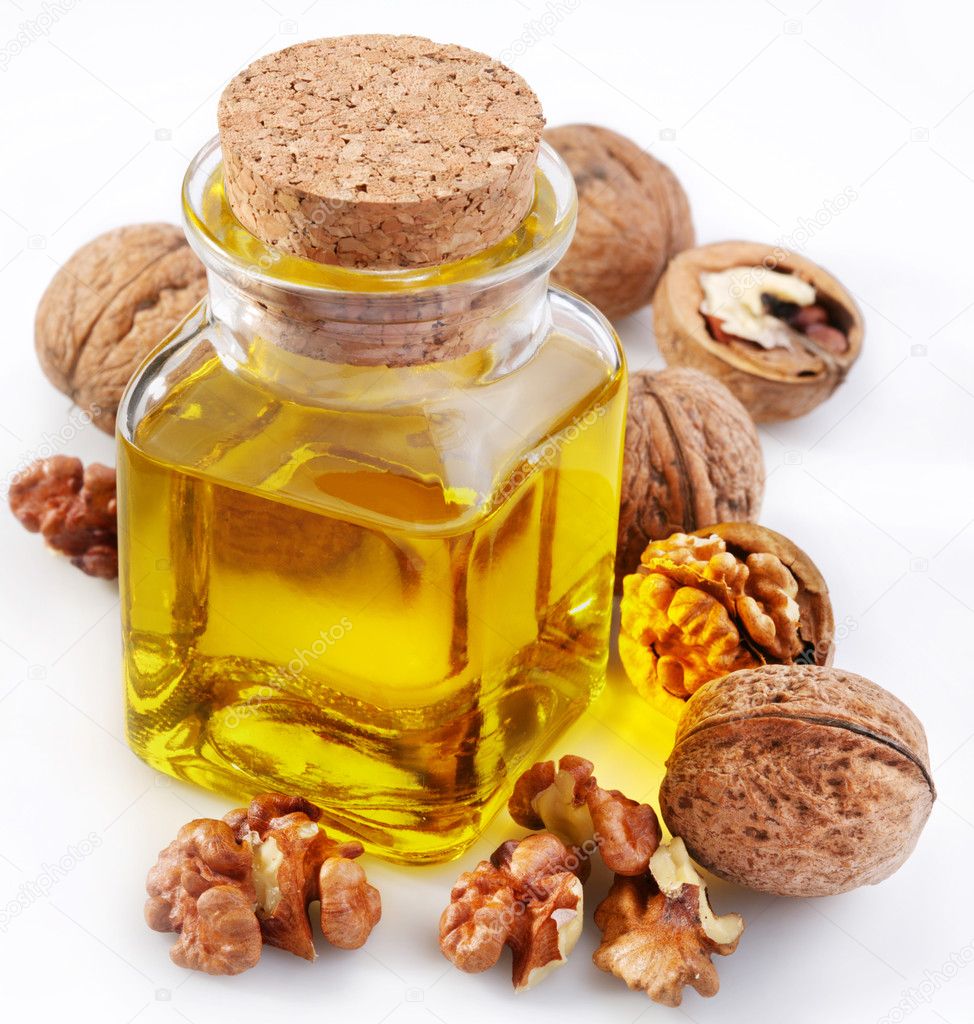 Walnut oil with nuts — Stock Photo © Valentyn_Volkov 3598530