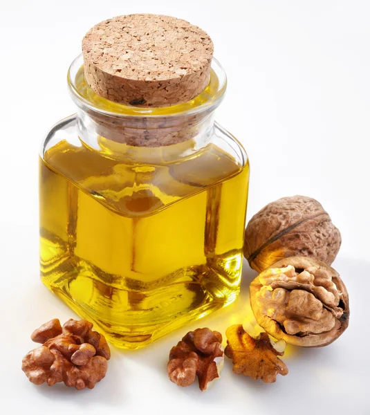Walnut oil with nuts — Stock Photo, Image