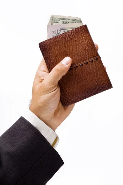 Bolsa com dólares em uma mão — Fotografia de Stock