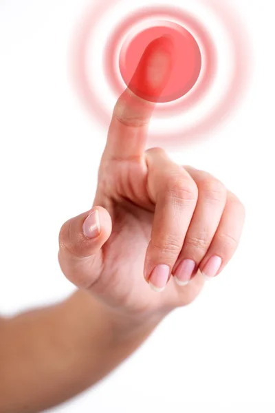 Червона кнопка, натиснута пальцем — стокове фото