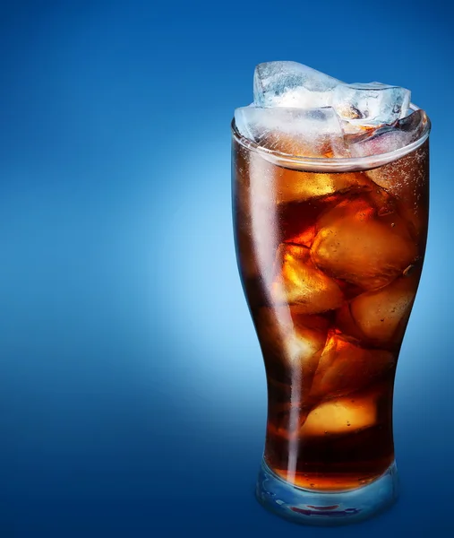 Glass of cola with ice on a blue background — Stock Photo, Image