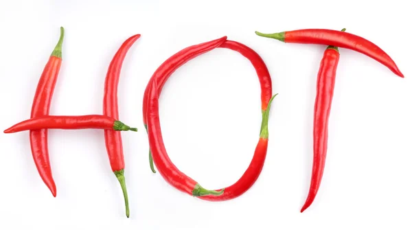 Das Wort "scharf" wird mit rotem Chilipfeffer ausgelegt — Stockfoto