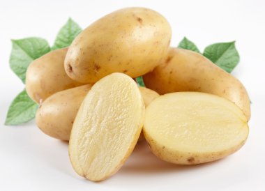 Yellow potatoes with leaves. clipart