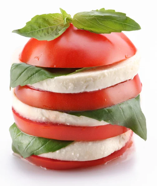 Lined with layers of cross-sections of tomato and mozzarella wit — Stock Photo, Image