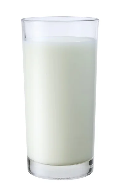 Pouring of milk from jar into a glass — Stock Photo, Image