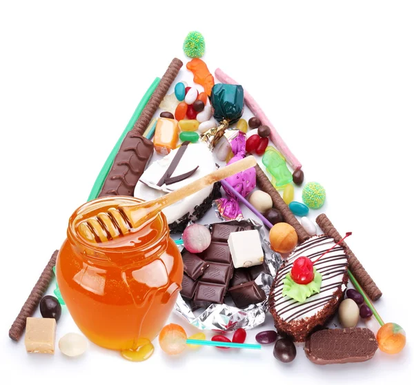 Pirámide en forma de dulces. Aislado sobre blanco — Foto de Stock