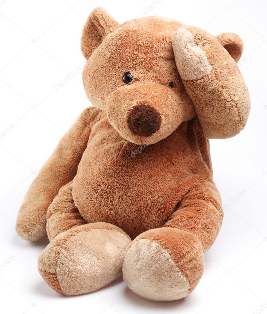 Teddy bear in a worry. Isolated over white.