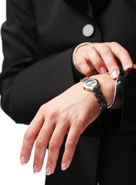 Businesswoman looks at his watch — Stock Photo, Image