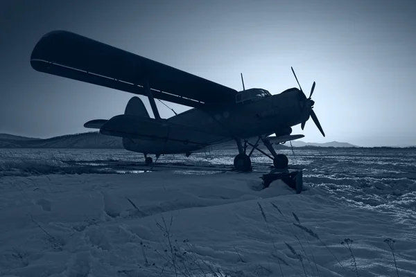 The dark blue plane on snow — Stock Photo, Image