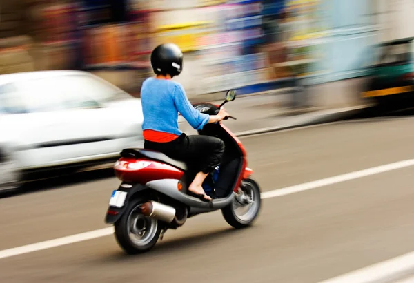 Riding a scooter — Stock Photo, Image