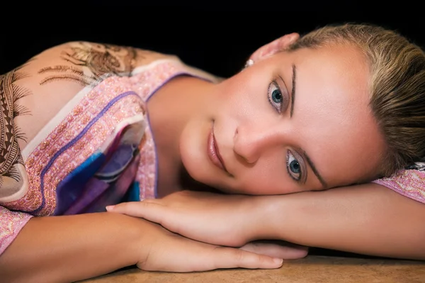 stock image Beautiful woman resting on her arms and thinking