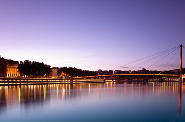 Image shows bridges over the Saone river, in Lyon, France, photographed at dusk