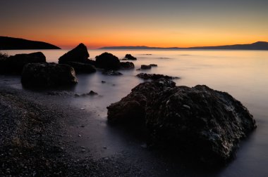 The rocky beach at Sadova, Greece clipart