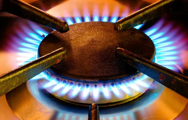 Old gas cooker hob in operation — Stock Photo, Image