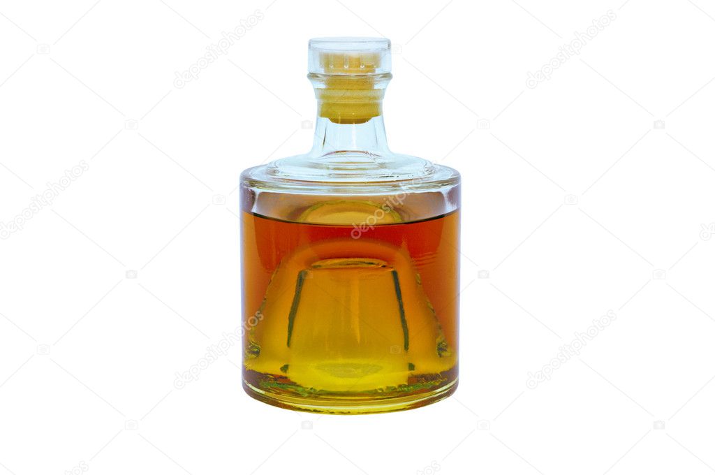 Glass bottle with alcohol on a white background
