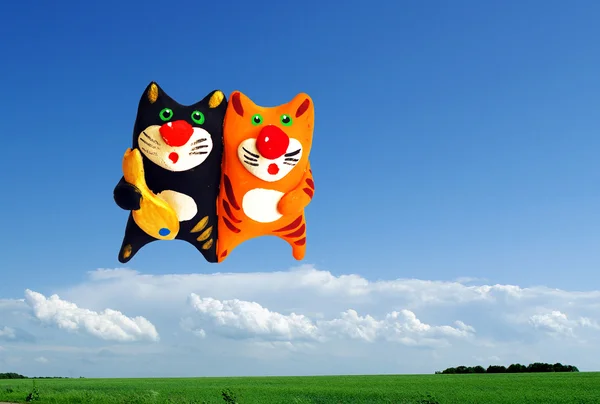 Two cats in the sky with fish — Stock Photo, Image
