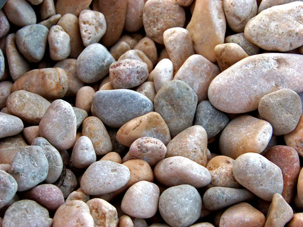 Black sea pebbles background — Stock Photo, Image