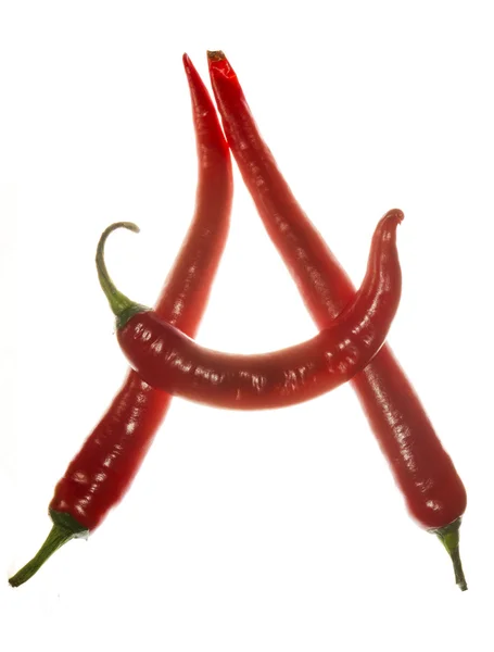 "Een "brief gemaakt van Chili pepers op witte achtergrond — Stockfoto