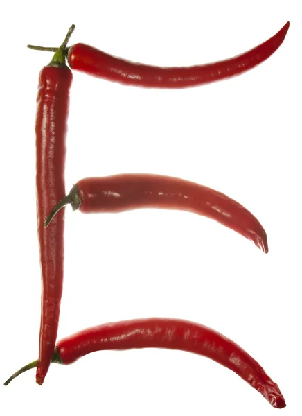 "E" letter made of chili peppers on white background — Stock Photo, Image