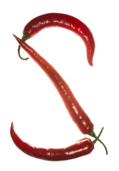 "S" letter made of chili peppers on white background — Stock Photo, Image