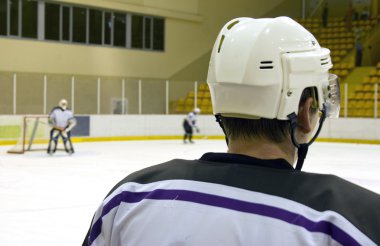 Monitoring hockey training clipart