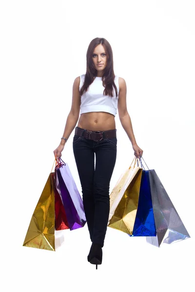 Young woman is going with paper bags — Stock Photo, Image