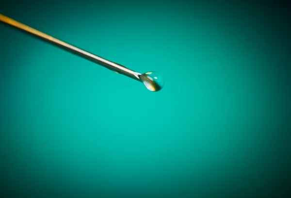 Needle with a drop medication close-up — Stock Photo, Image