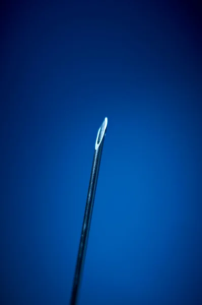 stock image Detail of a blue sterilized needle. Selective depth of focus to