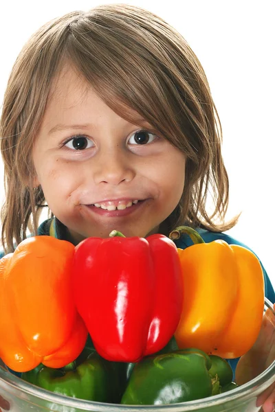 Adorable little boy holding peppers — Stock Photo, Image