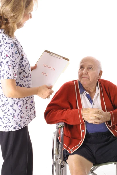 Elderly patient talking to nurse — Stock Photo, Image