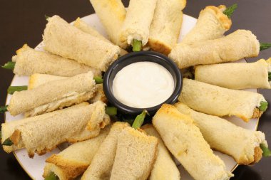 Asparagus appetizers with aoli dip clipart