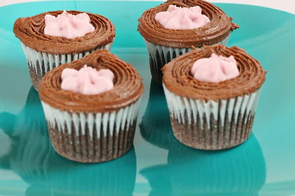 Chocolate cupcakes (focus on back) — Stock Photo, Image