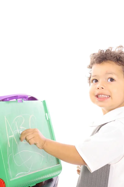 Happy toddler writing on chalkboard vertical — Stock Photo, Image