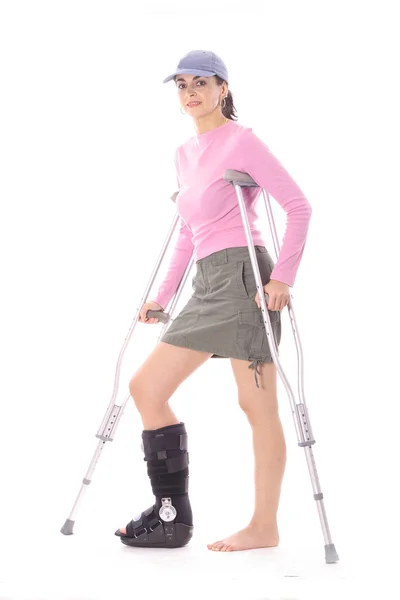 Woman with crutches — Stock Photo, Image