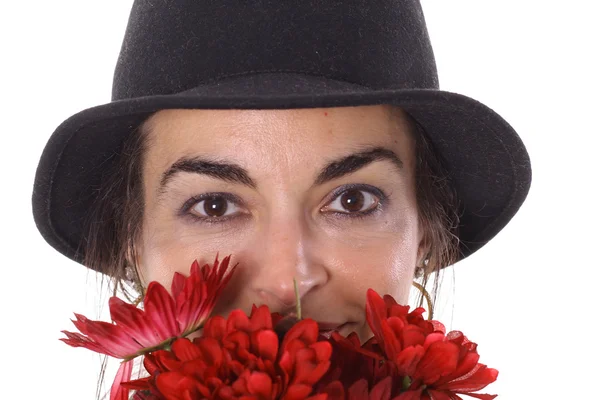 Woman in hat with flowers — Stock Photo, Image