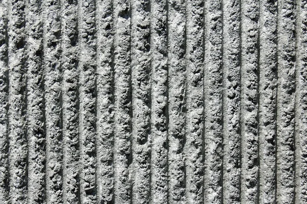 Muro di cemento grigio con linee verticali — Foto Stock