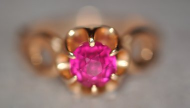 Purple diamond in gold ring clipart